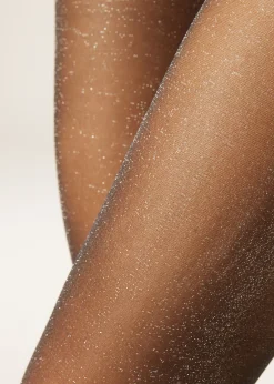 Collant transparent 20 deniers à paillettes